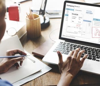 person paying legal bill on laptop