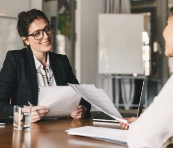 Female lawyer discussing contract in business meeting with her client