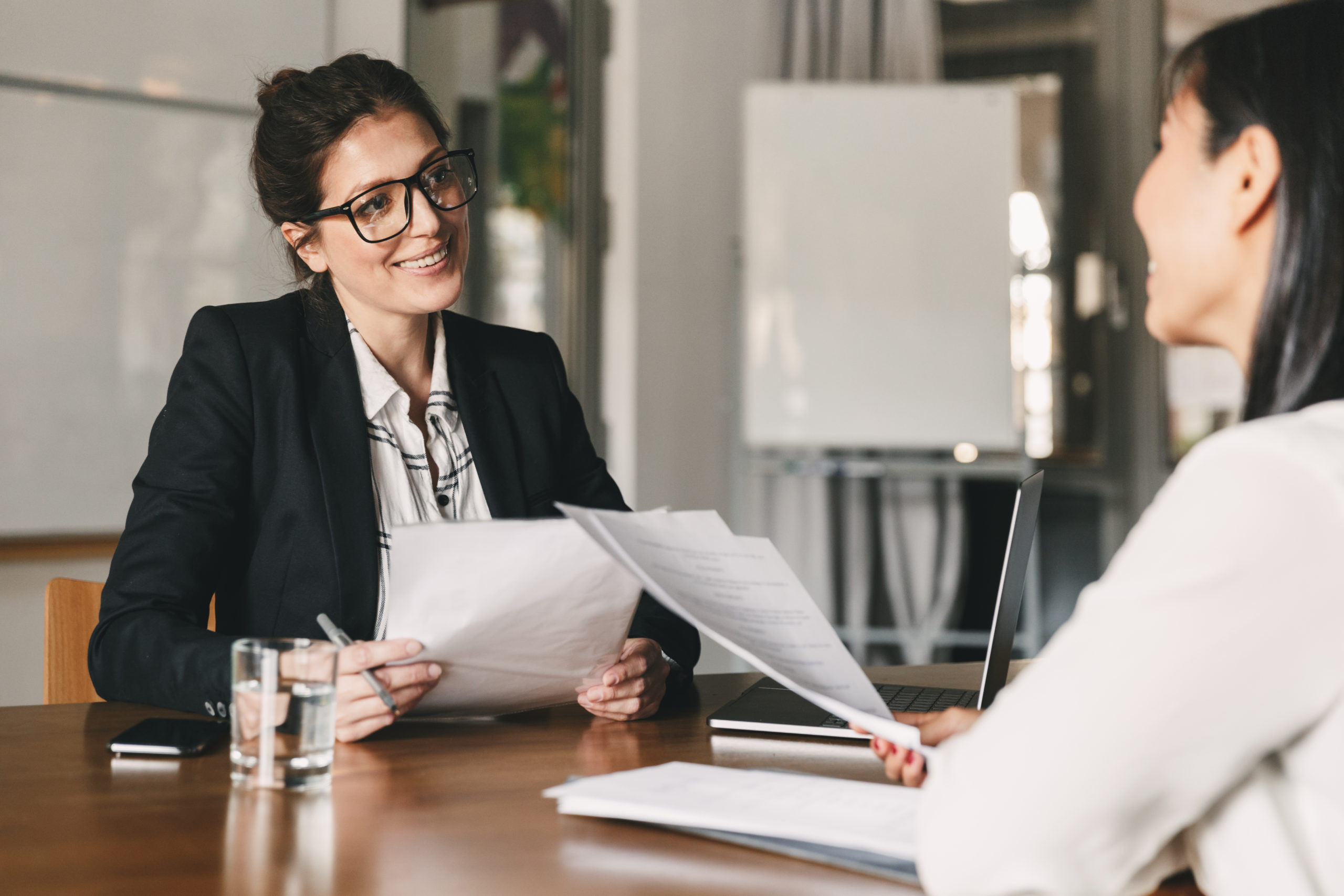 Female lawyer discussing contract in business meeting with her client