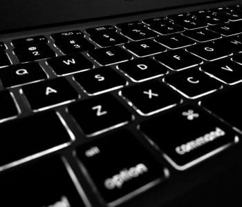 Close up of backlit Apple Macbook keyboard