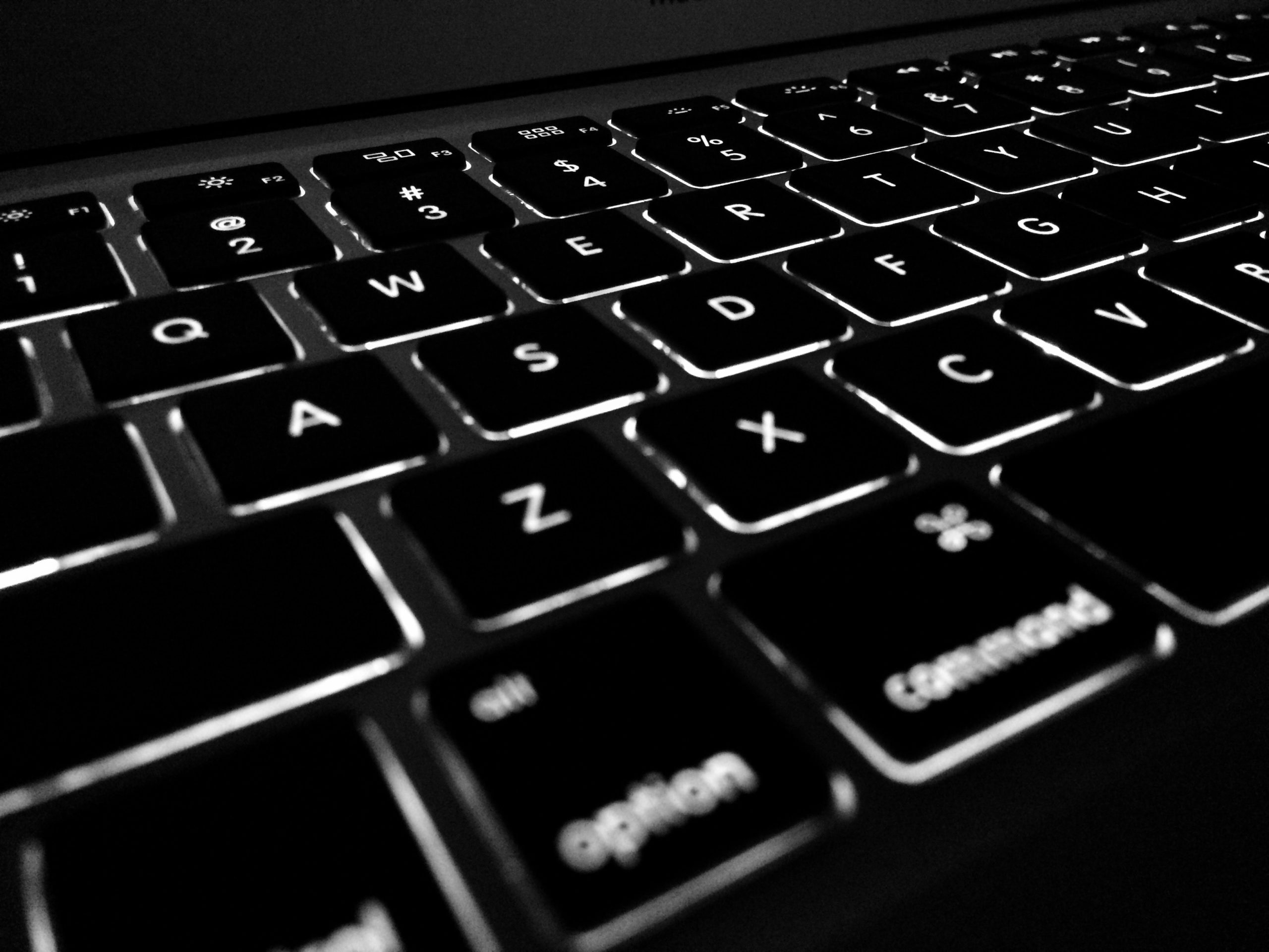 Close up of backlit Apple Macbook keyboard