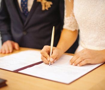 Couple signing wedding register