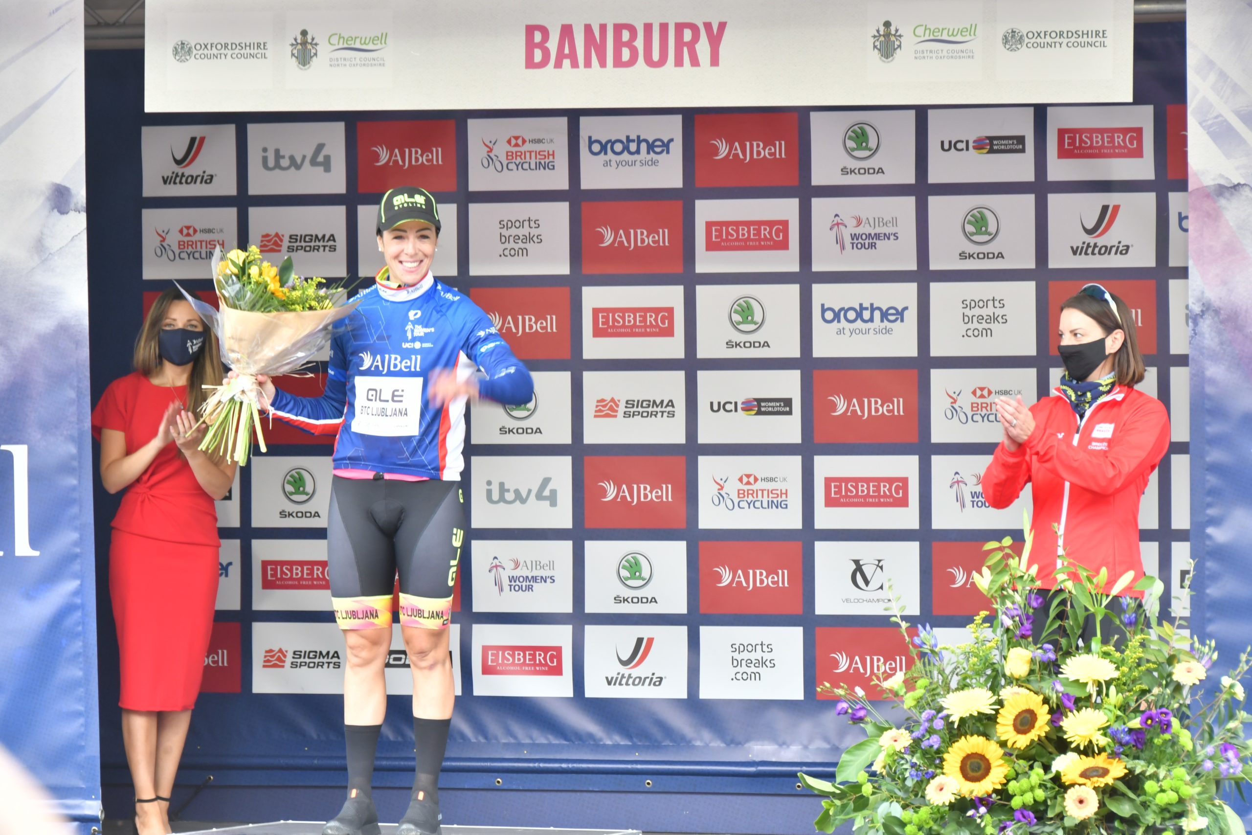 Marta Bastianelli presented with leaders jersey on stage by Heidi Yates from Spratt Endicott